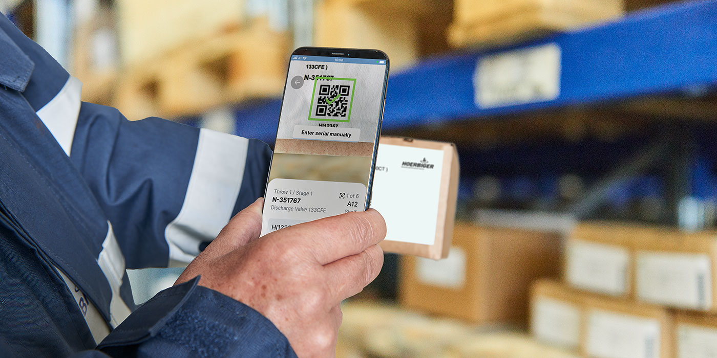 VISTRA scanning with App Man holding smartphone in his hand using the VISTRA App to scan a product